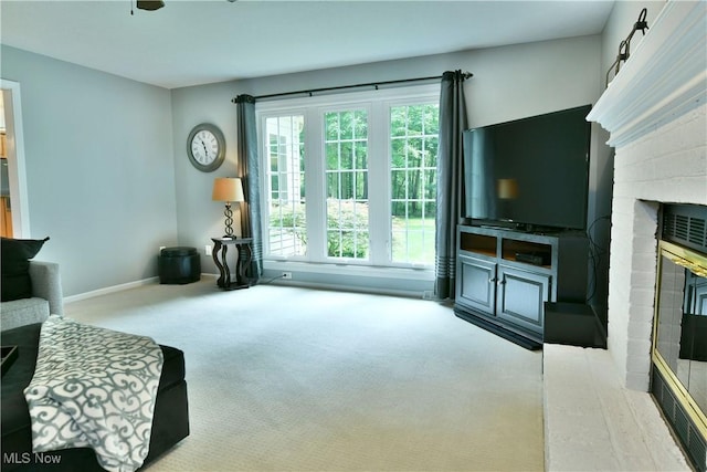 2878 Beaver Trl, Cortland, OH 44410 - carpeted living area with a brick fireplace and baseboards