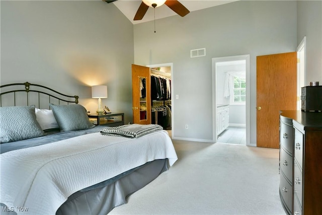 2878 Beaver Trl, Cortland, OH 44410 - bedroom featuring high vaulted ceiling, a spacious closet, light carpet, a closet, and connected bathroom