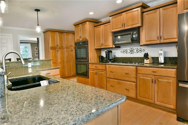 2878 Beaver Trl, Cortland, OH 44410 - kitchen featuring black appliances, light stone countertops, ornamental molding, light wood-style floors, and hanging light fixtures