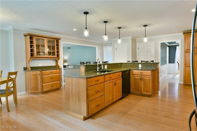 2878 Beaver Trl, Cortland, OH 44410 - kitchen featuring dishwasher, ornamental molding, light wood finished floors, brown cabinetry, and glass insert cabinets