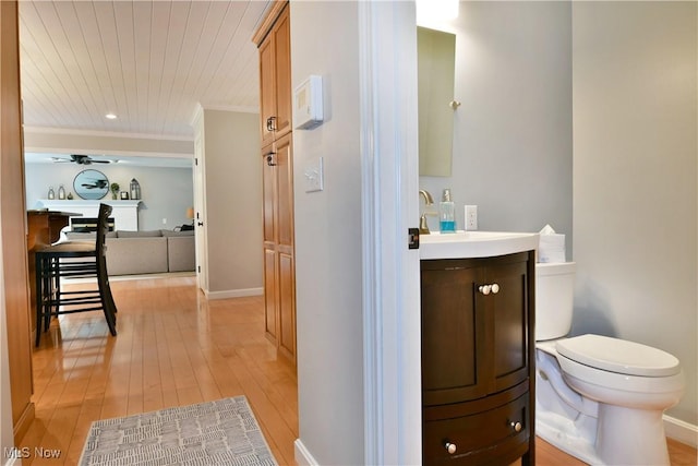 2878 Beaver Trl, Cortland, OH 44410 - bathroom featuring vanity, wood-type flooring, ornamental molding, and ceiling fan