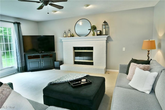 2878 Beaver Trl, Cortland, OH 44410 - carpeted living room with a ceiling fan and a brick fireplace