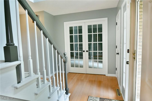 2878 Beaver Trl, Cortland, OH 44410 - foyer featuring french doors, hardwood / wood-style floors, and stairway