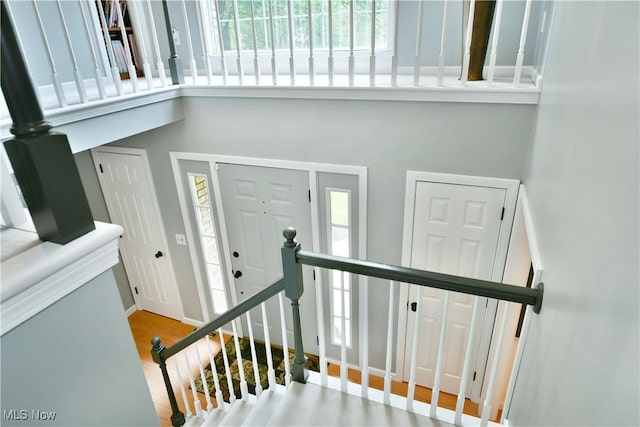 2878 Beaver Trl, Cortland, OH 44410 - stairs featuring a high ceiling and wood finished floors