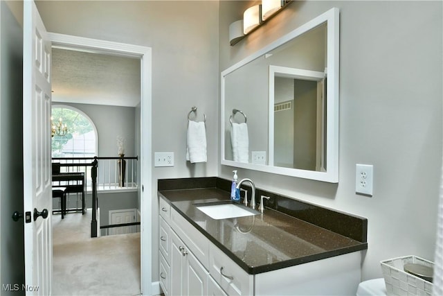 2878 Beaver Trl, Cortland, OH 44410 - bathroom featuring vanity and a chandelier
