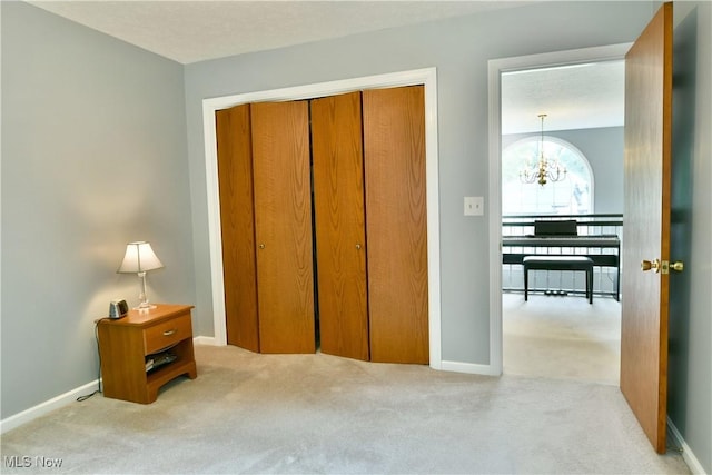 2878 Beaver Trl, Cortland, OH 44410 - carpeted bedroom featuring a chandelier and a closet