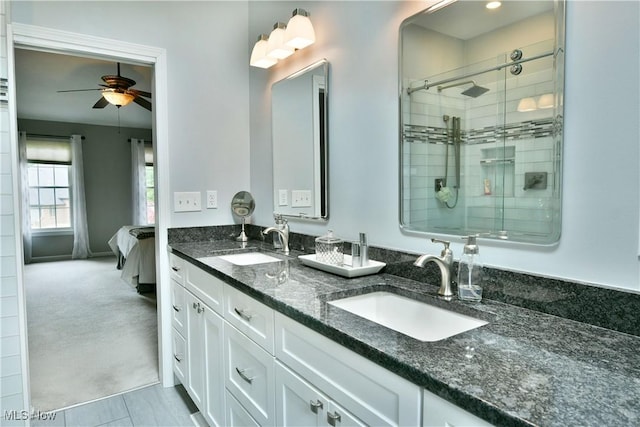 2878 Beaver Trl, Cortland, OH 44410 - ensuite bathroom featuring double vanity, ceiling fan, and a tile shower