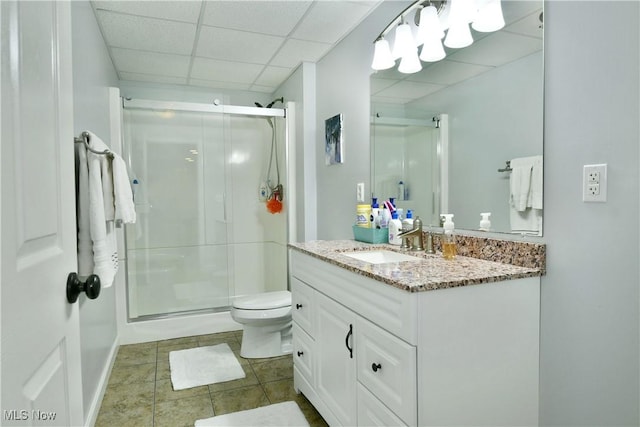 2878 Beaver Trl, Cortland, OH 44410 - bathroom with vanity, a shower stall, a paneled ceiling, and tile patterned flooring