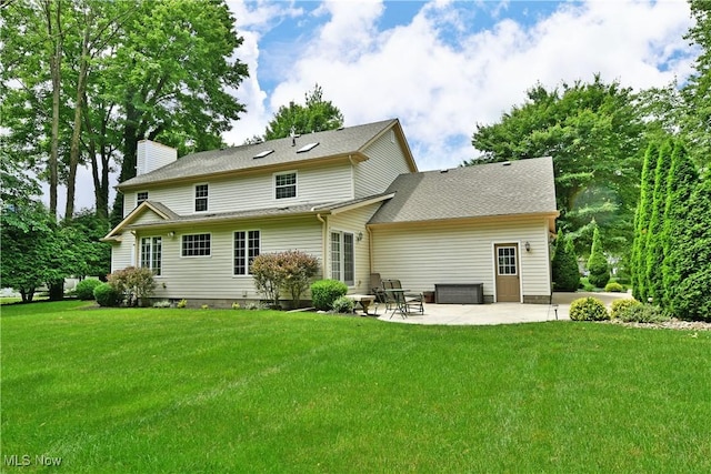 2878 Beaver Trl, Cortland, OH 44410 - back of house featuring a patio, a chimney, and a yard