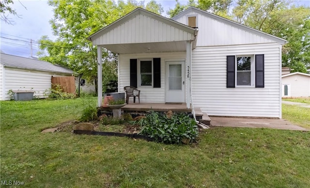 5458 Ridgewood, Lorain, OH 44055 - view of front of house with a porch and a front lawn