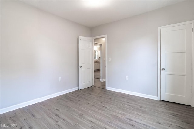 5458 Ridgewood, Lorain, OH 44055 - unfurnished bedroom featuring light wood-type flooring and baseboards