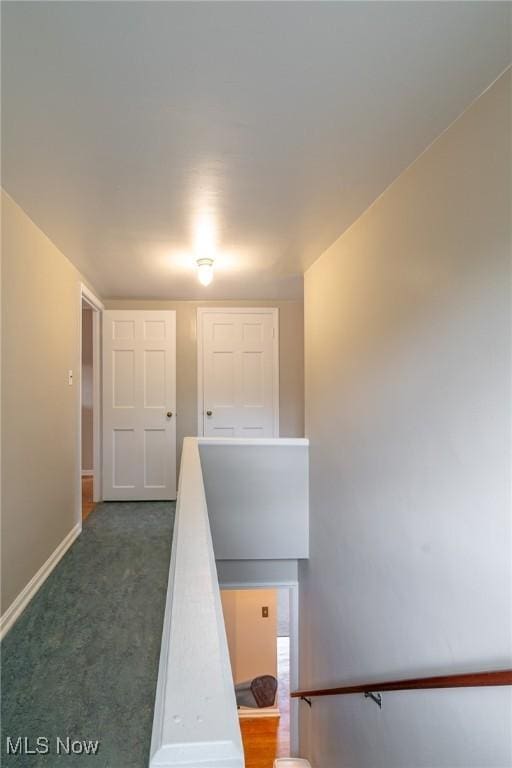 3975 Eastway Rd, South Euclid, OH 44118 - hallway featuring baseboards and dark carpet