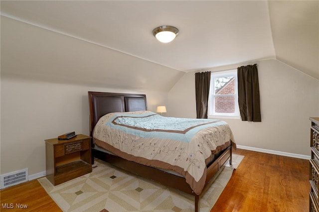 3975 Eastway Rd, South Euclid, OH 44118 - bedroom featuring light wood-type flooring and vaulted ceiling