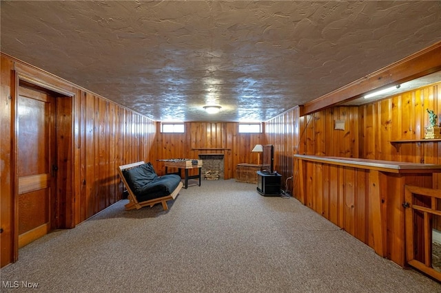 3975 Eastway Rd, South Euclid, OH 44118 - sitting room featuring carpet, wooden walls, and a textured ceiling