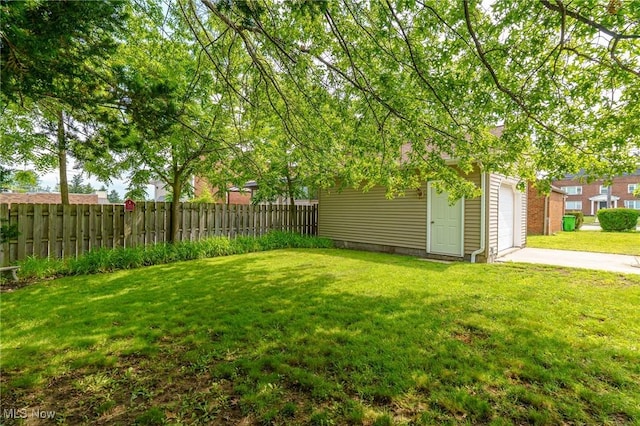 3975 Eastway Rd, South Euclid, OH 44118 - view of yard with concrete driveway, a garage, and an outdoor structure