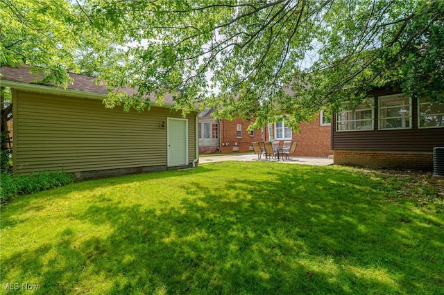 3975 Eastway Rd, South Euclid, OH 44118 - view of green lawn with a patio