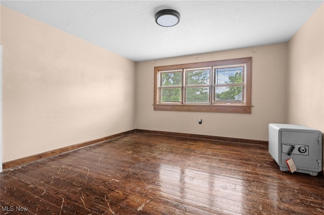 11861 Moffitt St SW, Massillon, OH 44647 - spare room with hardwood / wood-style floors and baseboards