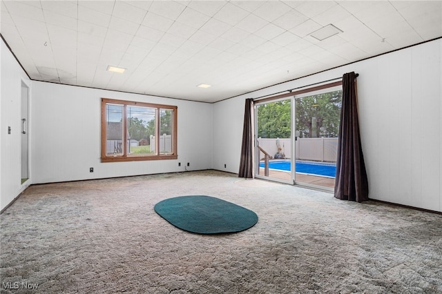 11861 Moffitt St SW, Massillon, OH 44647 - carpeted empty room featuring healthy amount of natural light