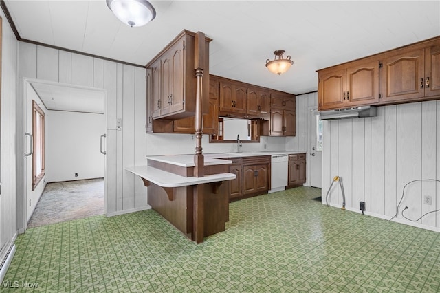 11861 Moffitt St SW, Massillon, OH 44647 - kitchen featuring light floors, white dishwasher, light countertops, a peninsula, and a kitchen bar