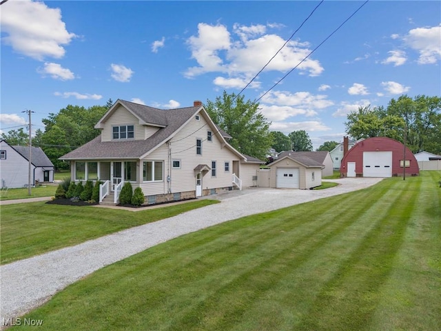 11861 Moffitt St SW, Massillon, OH 44647 - view of front of property featuring a garage, driveway, an outdoor structure, a front lawn, and roof with shingles