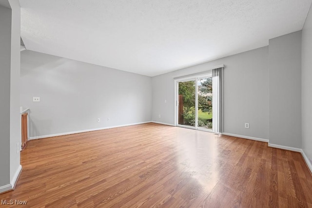 713 Gold Leaf, Streetsboro, OH 44241 - empty room with wood finished floors and a textured ceiling