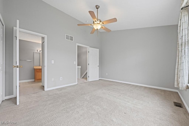 713 Gold Leaf, Streetsboro, OH 44241 - unfurnished bedroom with carpet, high vaulted ceiling, connected bathroom, and a ceiling fan