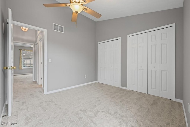 713 Gold Leaf, Streetsboro, OH 44241 - unfurnished bedroom featuring carpet, multiple closets, lofted ceiling, and ceiling fan