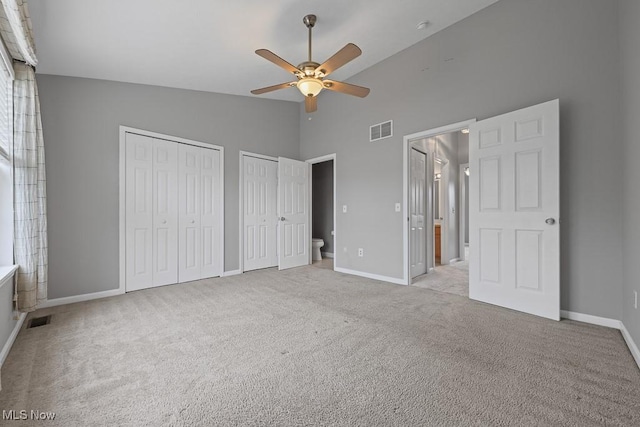 713 Gold Leaf, Streetsboro, OH 44241 - unfurnished bedroom with two closets, carpet flooring, high vaulted ceiling, a ceiling fan, and ensuite bath
