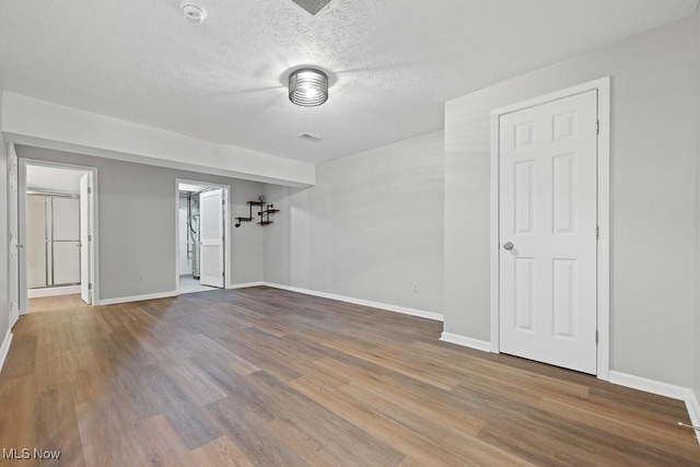 713 Gold Leaf, Streetsboro, OH 44241 - empty room with wood finished floors and a textured ceiling
