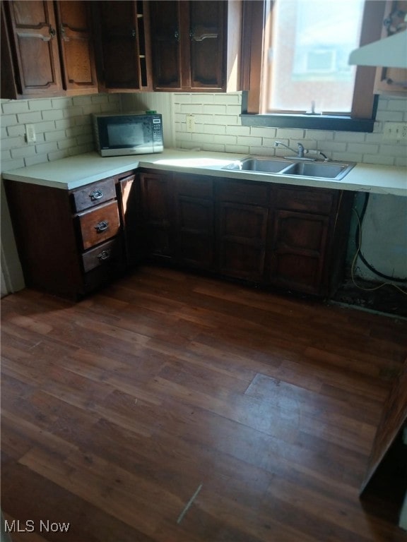 1954 Everett Ave, Youngstown, OH 44514 - kitchen featuring black microwave, dark wood-type flooring, light countertops, and tasteful backsplash