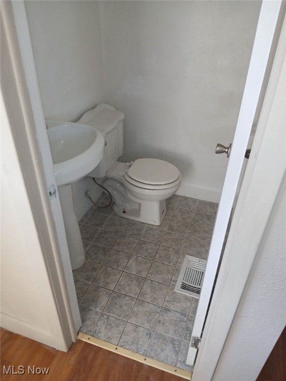 1954 Everett Ave, Youngstown, OH 44514 - bathroom featuring toilet and tile patterned floors