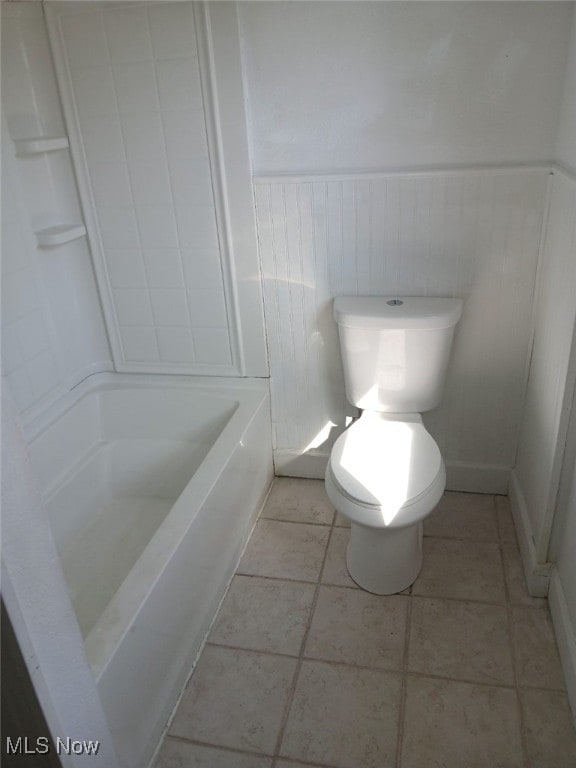 1954 Everett Ave, Youngstown, OH 44514 - bathroom featuring a wainscoted wall,  shower combination, and tile patterned floors