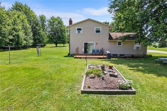 40698 Whitney Rd, Lagrange, OH 44050 - back of property with a wooden deck, a lawn, a chimney, and a vegetable garden