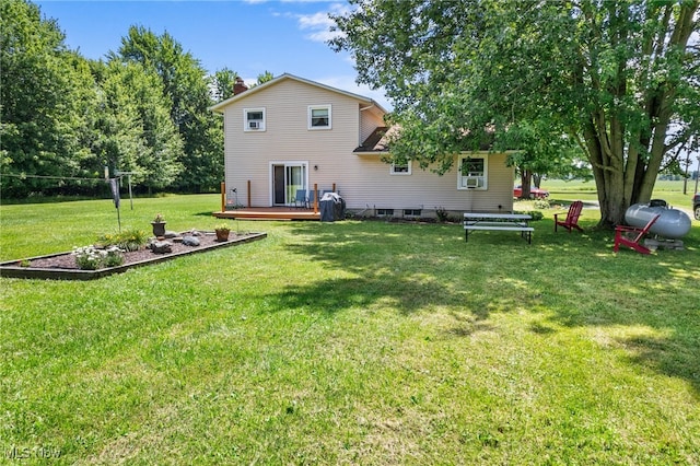 40698 Whitney Rd, Lagrange, OH 44050 - back of property featuring a deck, a yard, a chimney, and cooling unit
