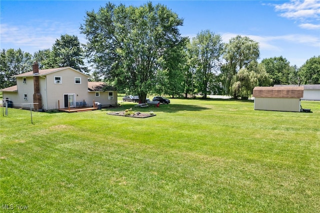 40698 Whitney Rd, Lagrange, OH 44050 - view of grassy yard featuring a storage unit and a deck