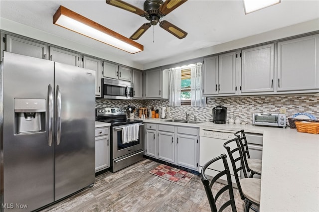 40698 Whitney Rd, Lagrange, OH 44050 - kitchen with appliances with stainless steel finishes, gray cabinets, and light countertops