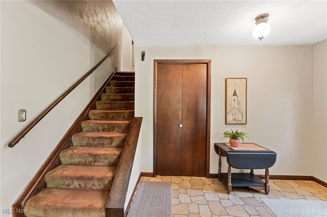 40698 Whitney Rd, Lagrange, OH 44050 - staircase with baseboards and a textured ceiling