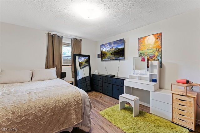 40698 Whitney Rd, Lagrange, OH 44050 - bedroom with light wood-style floors and a textured ceiling
