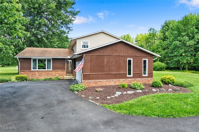 40698 Whitney Rd, Lagrange, OH 44050 - view of front of property featuring brick siding, a front lawn, driveway, and a shingled roof