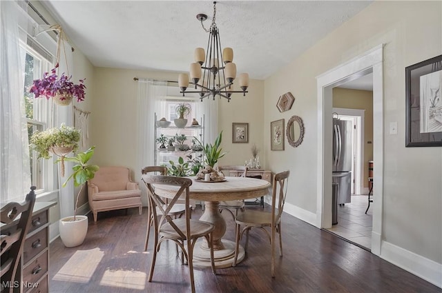583 E 7th St, Salem, OH 44460 - dining space with dark wood-style flooring and a chandelier