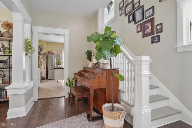 583 E 7th St, Salem, OH 44460 - staircase with wood finished floors and decorative columns