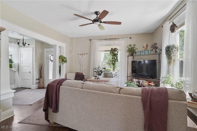 583 E 7th St, Salem, OH 44460 - living area with healthy amount of natural light, a ceiling fan, wood finished floors, and a chandelier