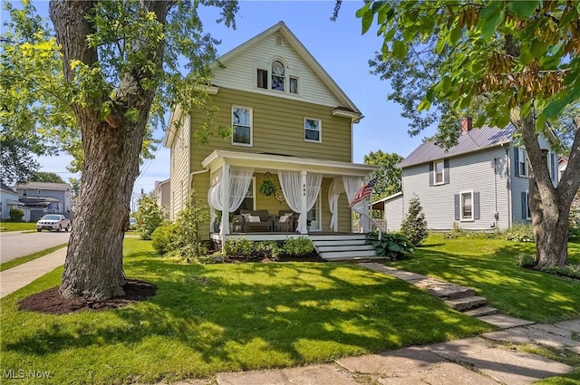 583 E 7th St, Salem, OH 44460 - american foursquare style home featuring a porch and a front yard