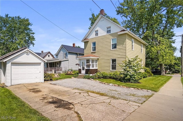 583 E 7th St, Salem, OH 44460 - view of front of house with driveway, a front yard, a chimney, and a detached garage