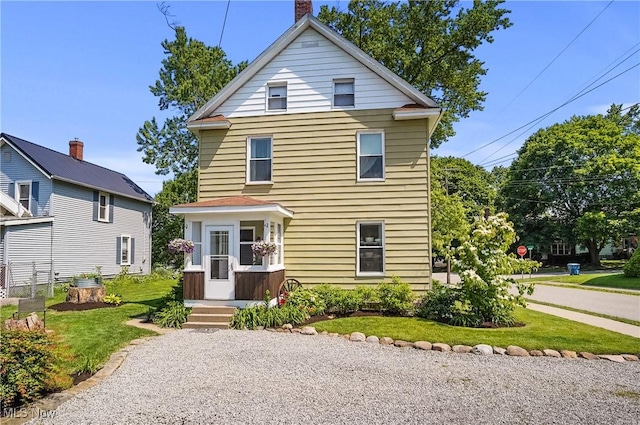 583 E 7th St, Salem, OH 44460 - view of front of property with a chimney and a front yard