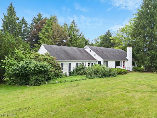5352 Hills And Dales Rd NW, Canton, OH 44708 - view of front of house with a front lawn and a chimney