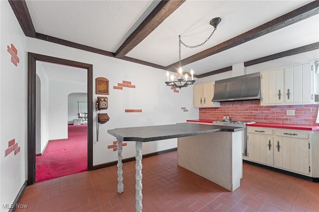 5352 Hills And Dales Rd NW, Canton, OH 44708 - kitchen featuring wall chimney range hood, gas stove, dark countertops, beamed ceiling, and brick patterned floors
