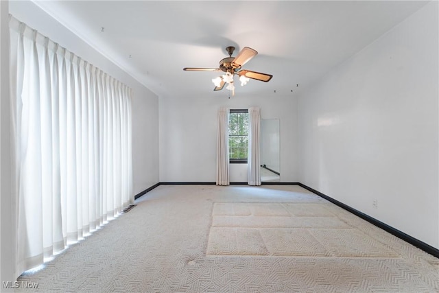 5352 Hills And Dales Rd NW, Canton, OH 44708 - spare room with light colored carpet and a ceiling fan