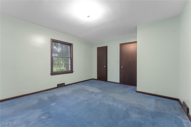 5352 Hills And Dales Rd NW, Canton, OH 44708 - unfurnished bedroom with two closets and carpet flooring