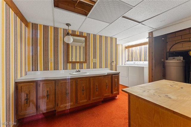 5352 Hills And Dales Rd NW, Canton, OH 44708 - bathroom with washer and clothes dryer, vanity, a drop ceiling, and wallpapered walls